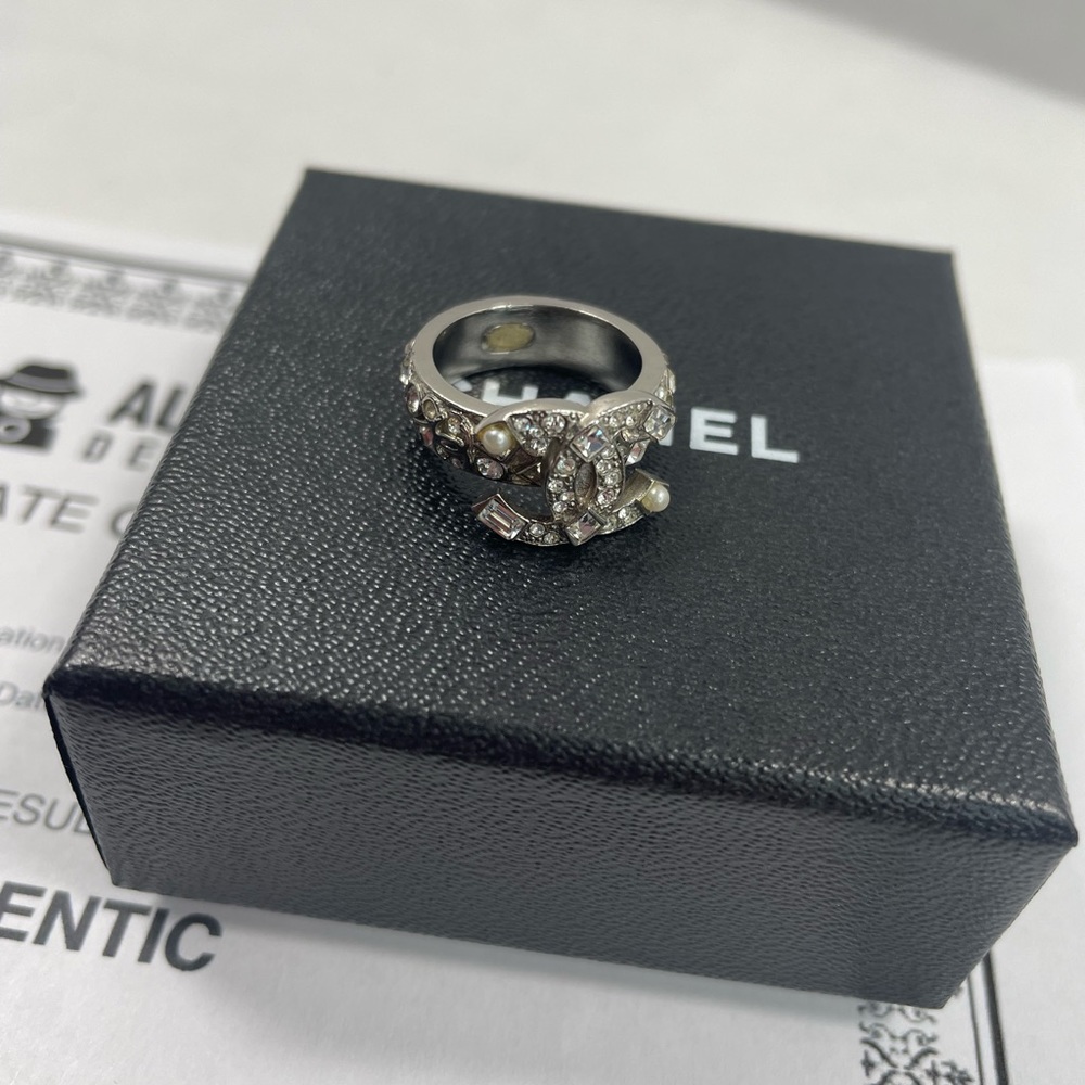 Authentic CHANEL, rhinestone silver tone ring size  5 1/2” with box and COA